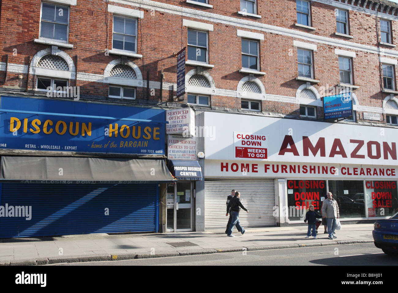 A row of empty shops, recently closed in the harsh economic climate. Kilburn High Road, London. Stock Photo