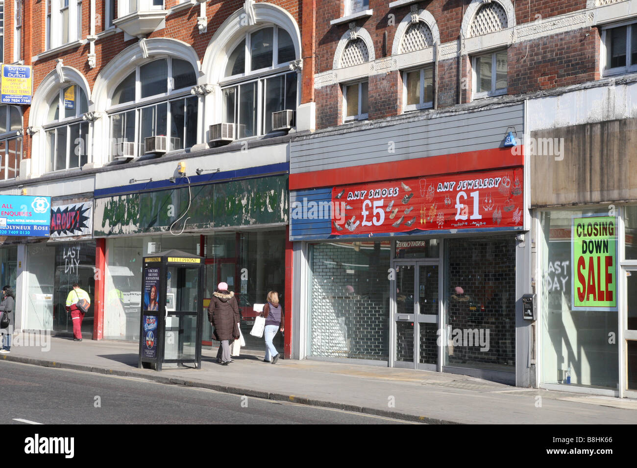 A row of 4 empty shops, recently closed in the harsh economic climate