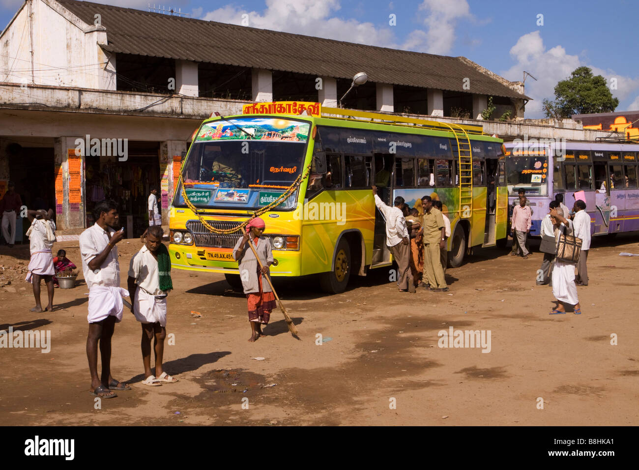 India Tamil Nadu Mayiladuthurai Bus Stand passengers boarding local buses Stock Photo