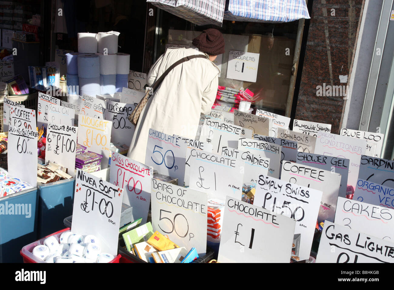 a shop selling cut price goods thriving, reflecting the harsh economic