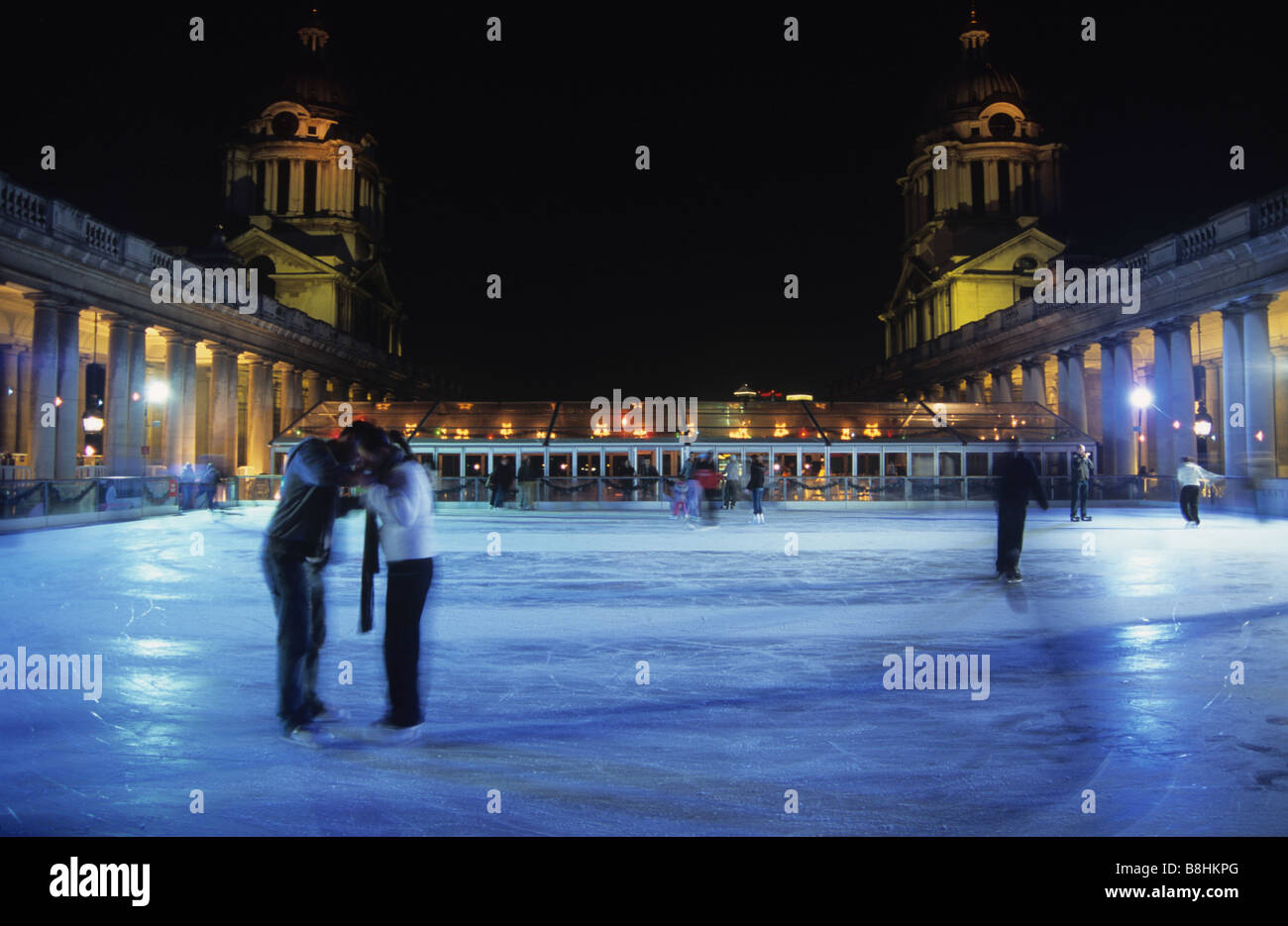 Ice skaters embrace at Greenwich rink during the Christmas skating