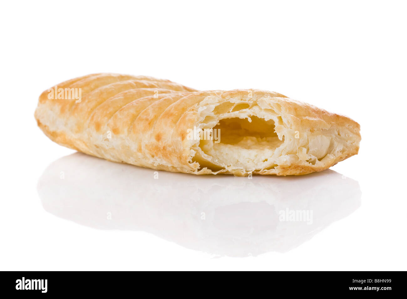 Puff pastry stuffed with melted cheese isolated on white background Stock Photo
