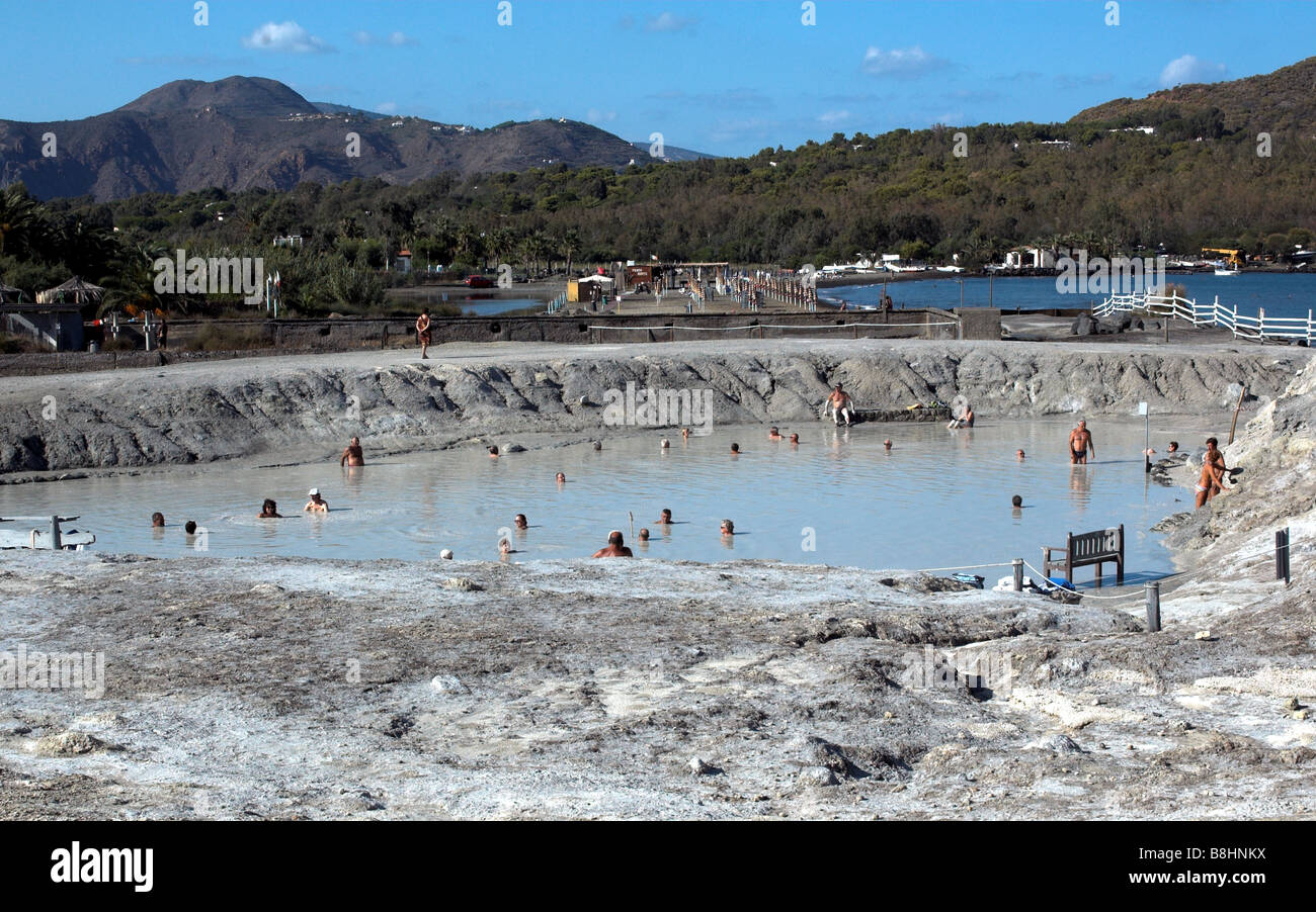 view of tourist enjoying mud bath on island of Vulcano in the aeolian