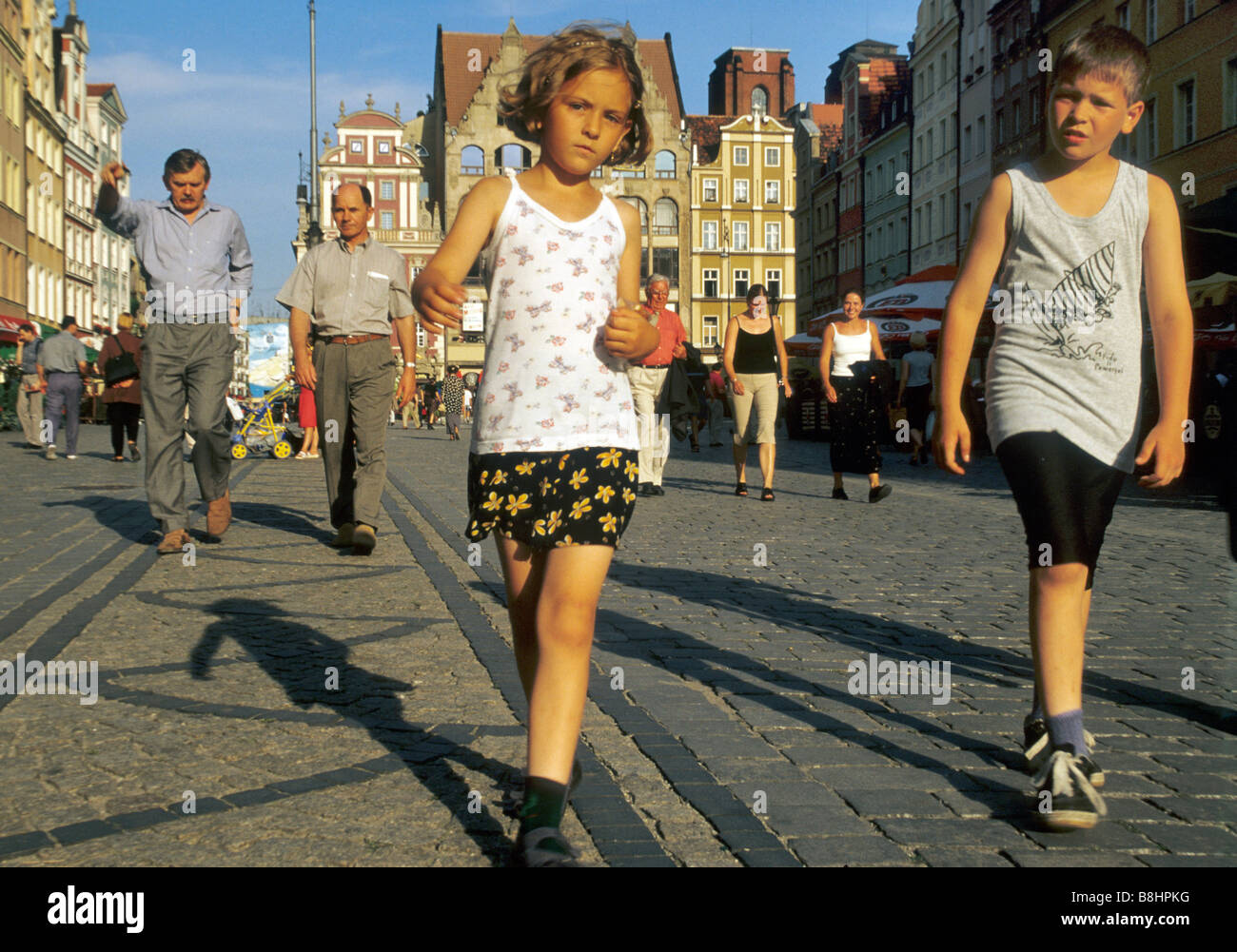 Children strolling at Rynek (Town Square), Wroclaw, Poland Stock Photo