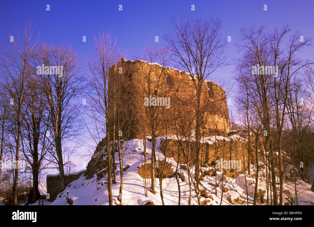 Medieval castle ruins near village of Swiecie at sunset in winter in Lower Silesia region Poland Stock Photo