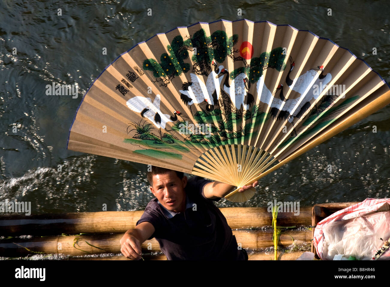 Chinese vendor selling various goods hires stock photography and