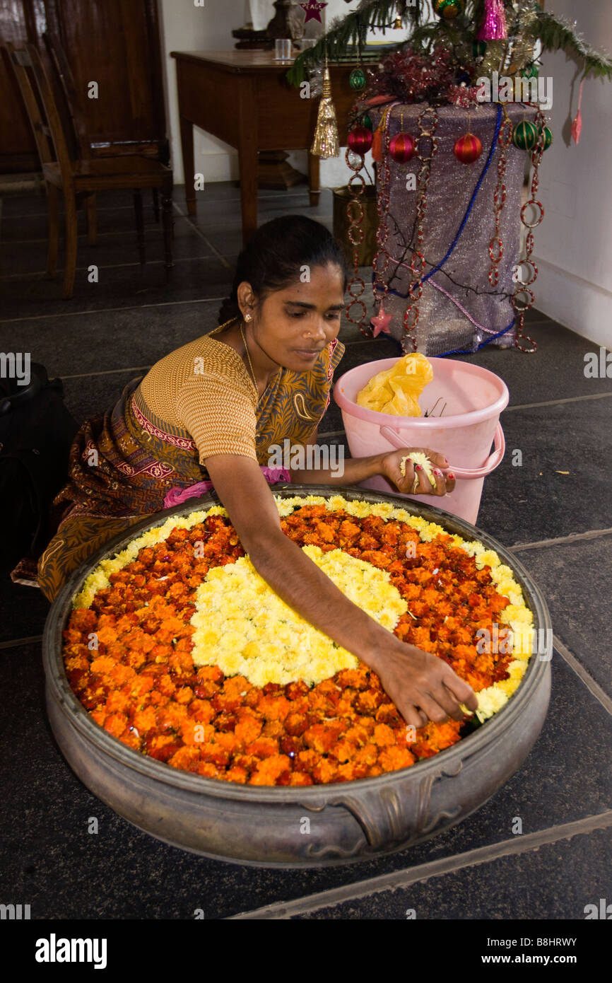 India Pondicherry Romain Rolland Street Hotel de lOrient woman arranging flower heads Stock Photo