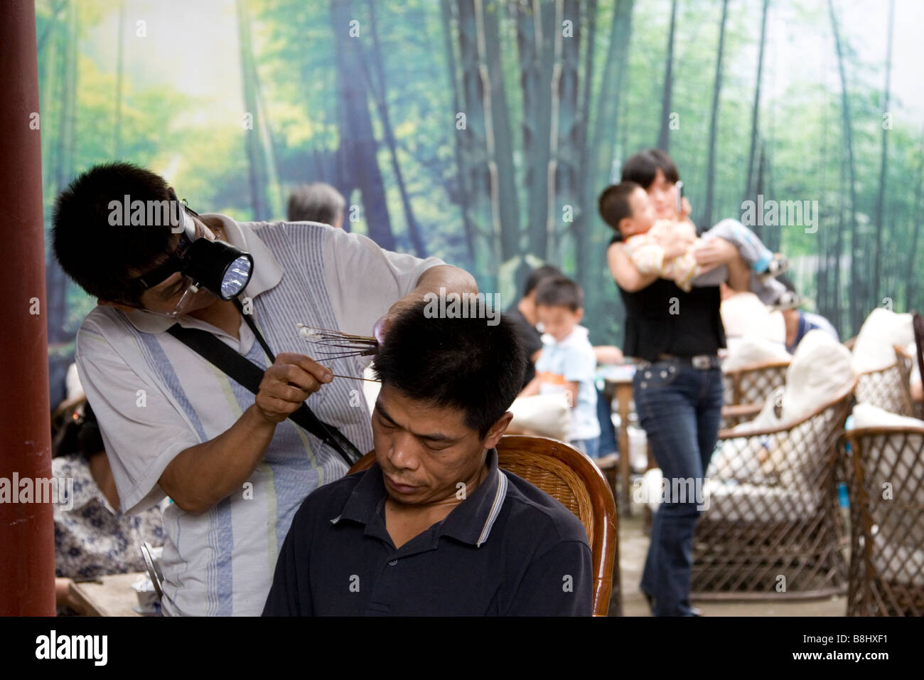 Ear cleaners ply their trade in the teahouses in Chengdu Sichuan China Stock Photo