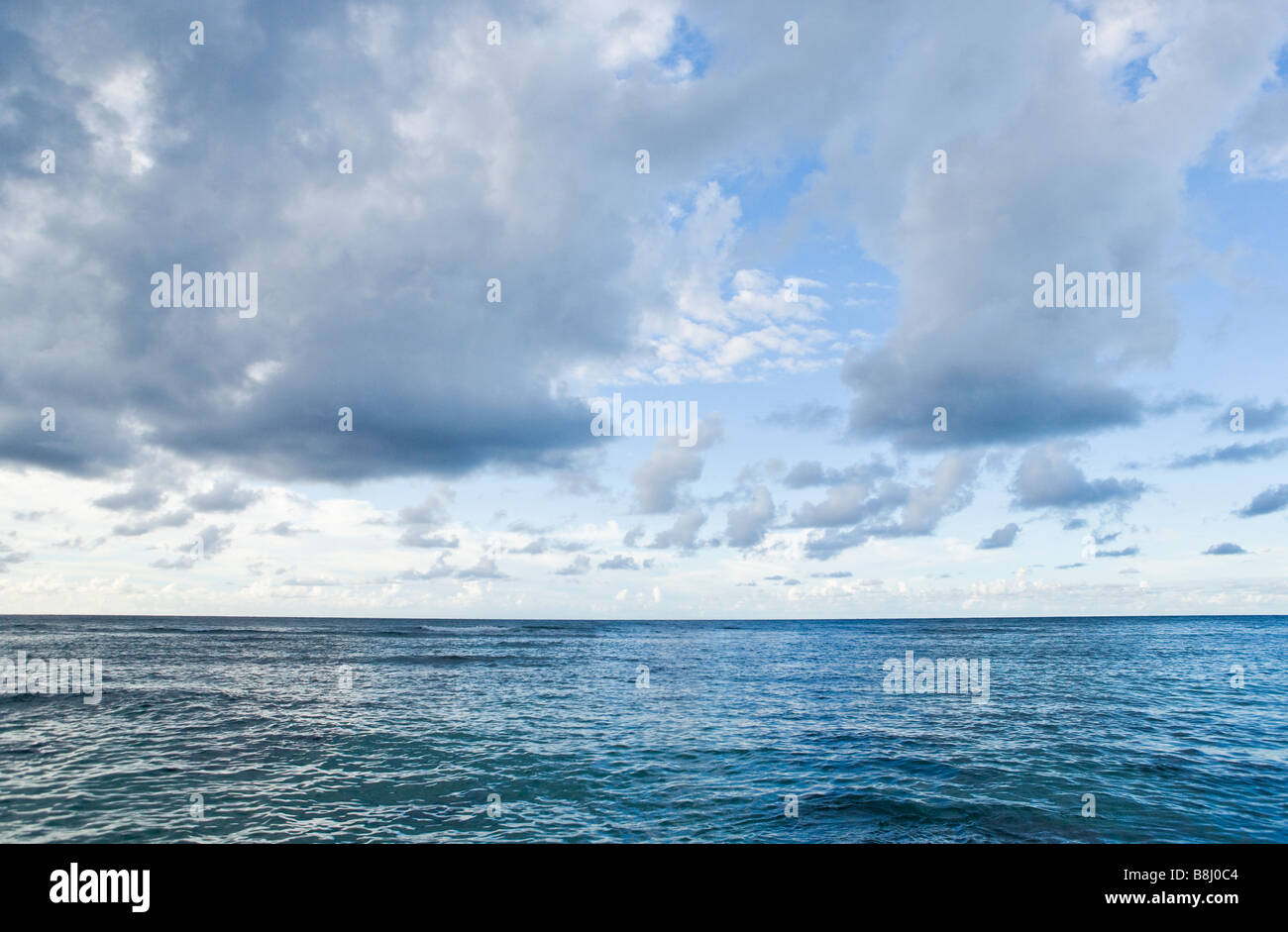 The Pacific Ocean with clouds in the late afternoon on the north shore of Kauai Hawaii Stock Photo