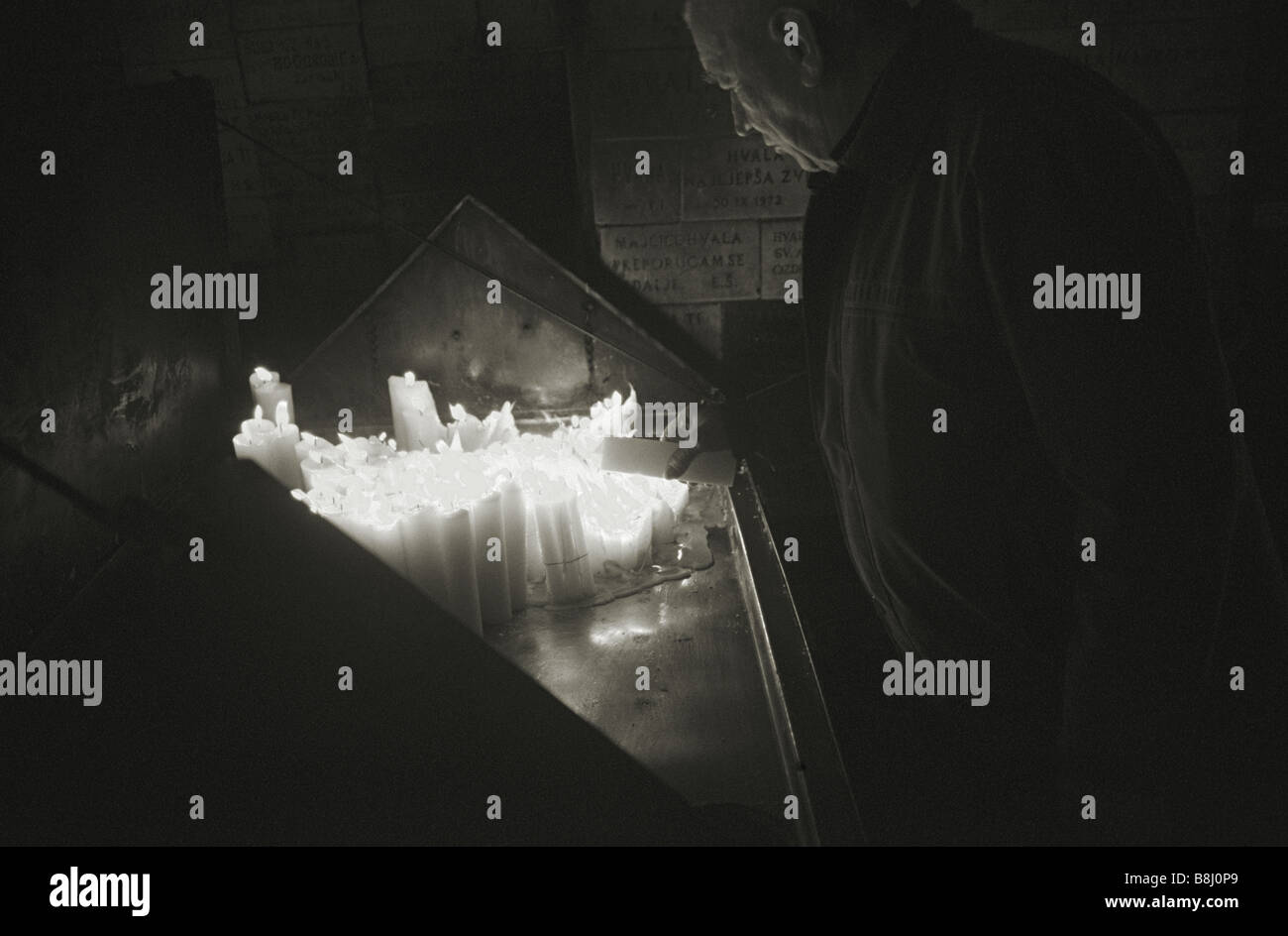 Man burning candles, Zagreb, Croatia Stock Photo Alamy