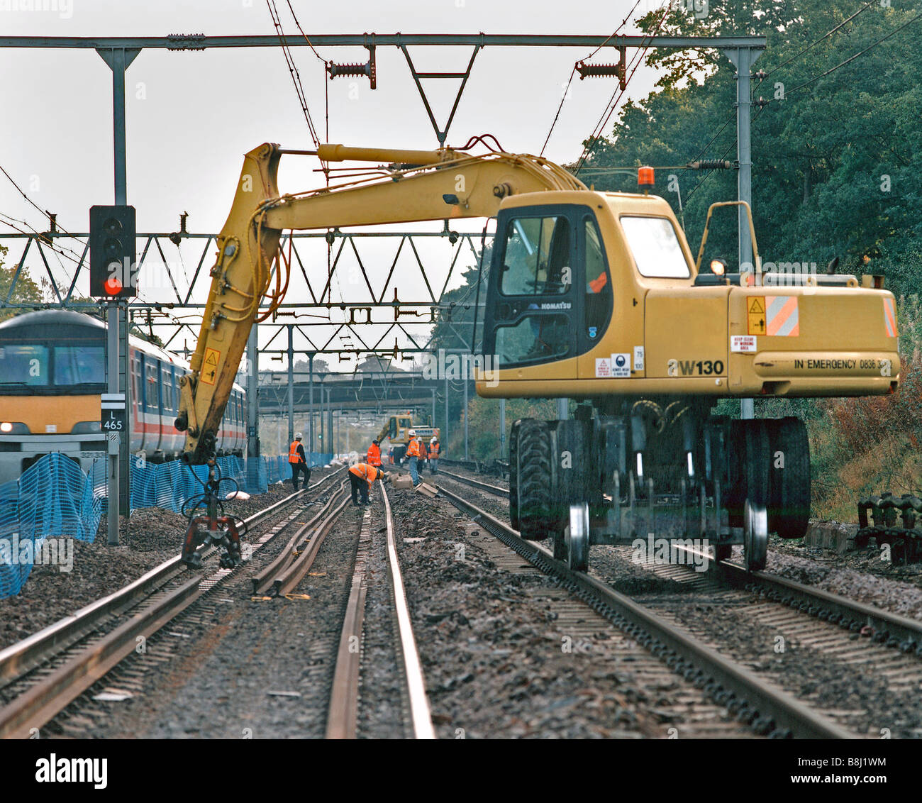 RoadRail machine working within a clearly marked railway blockade, the