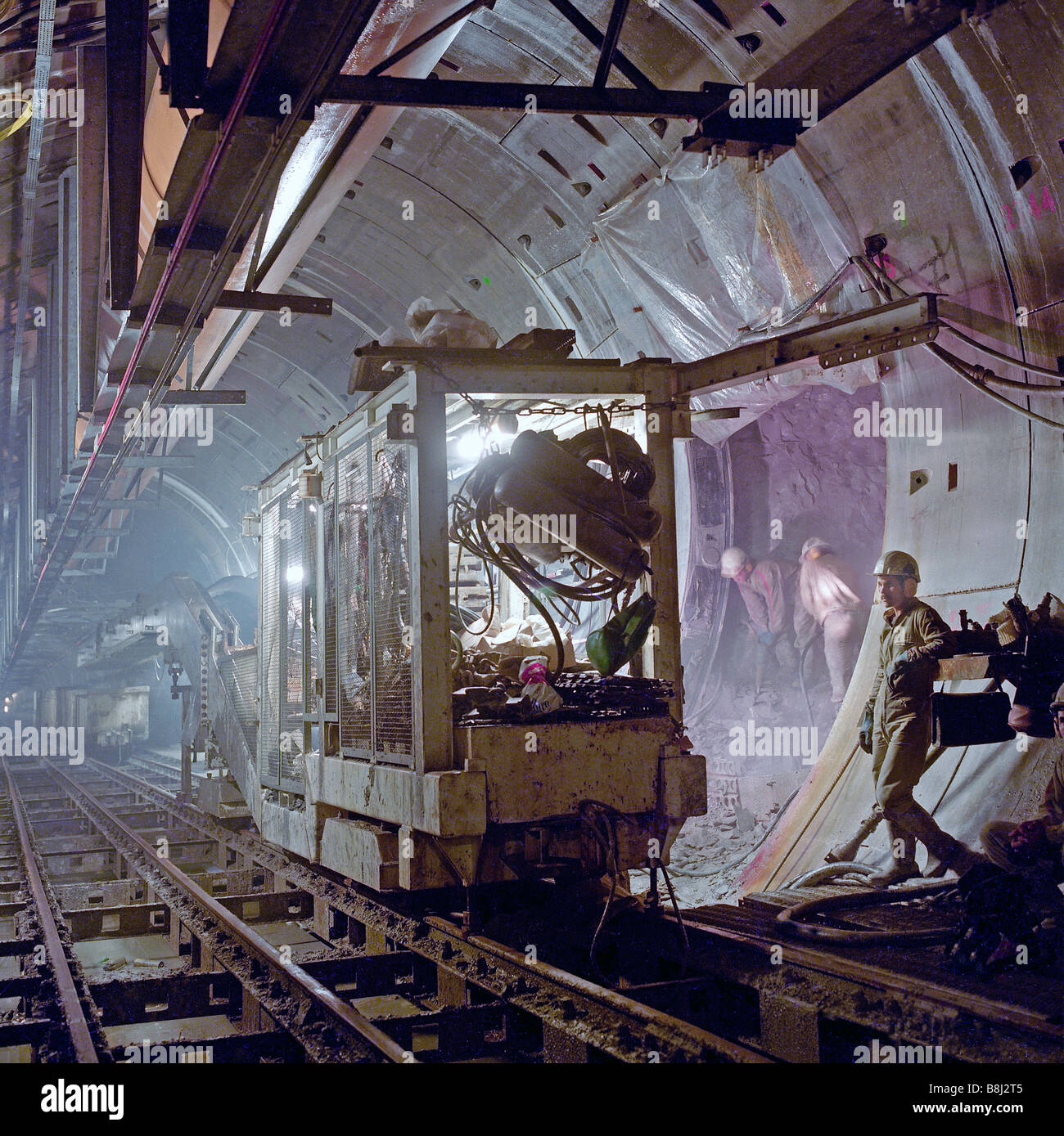 French workers excavating a cross passage between two rail tunnels by