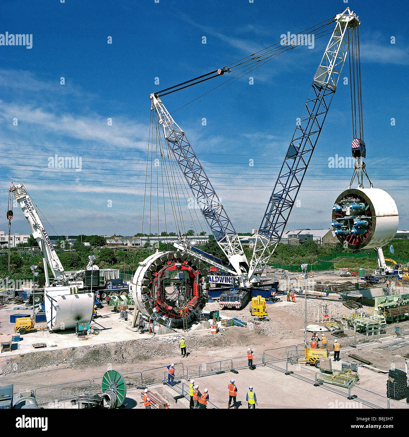1200 tonne crane lifts shield for Tunnel Boring Machine 'Annie' into underground launch chamber on Channel Tunnel Rail Link. Stock Photo