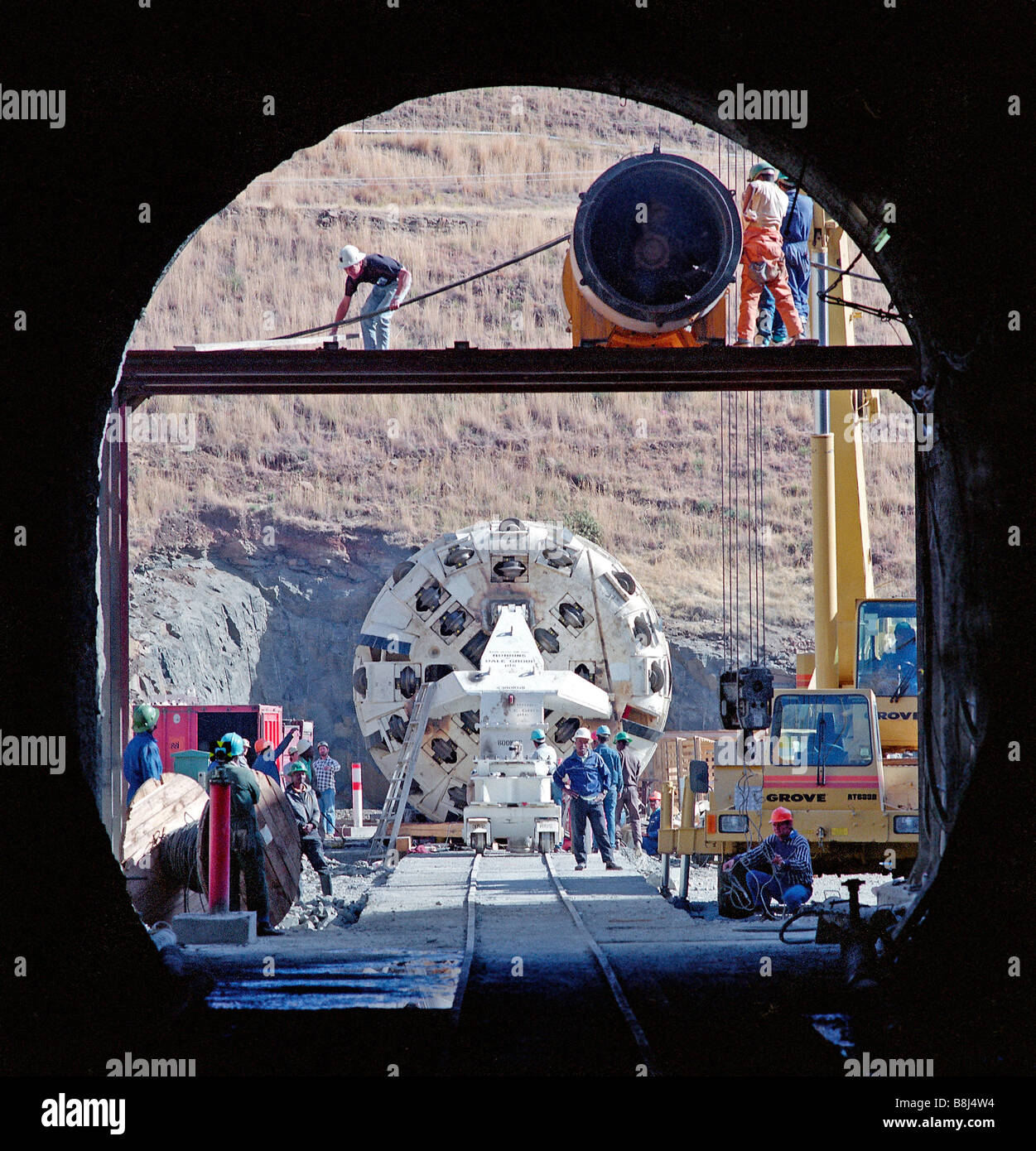 Engineers move fully assembled tunnel boring machine into access adit on the historic 30-year Lesotho Highlands Water Project. Stock Photo