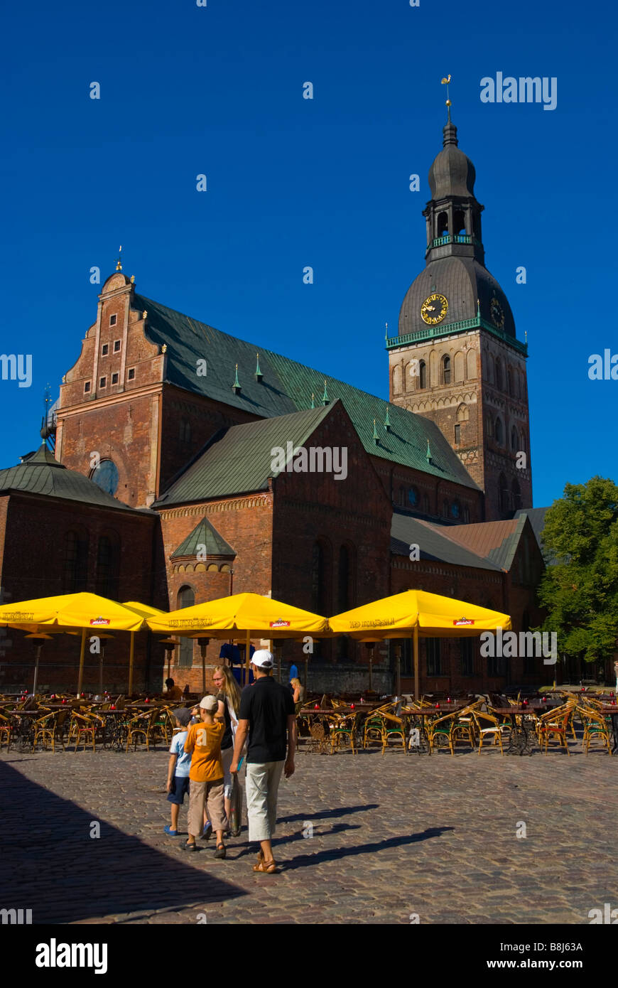 Family at Doma laukums square with Doma baznica cathedral in Riga