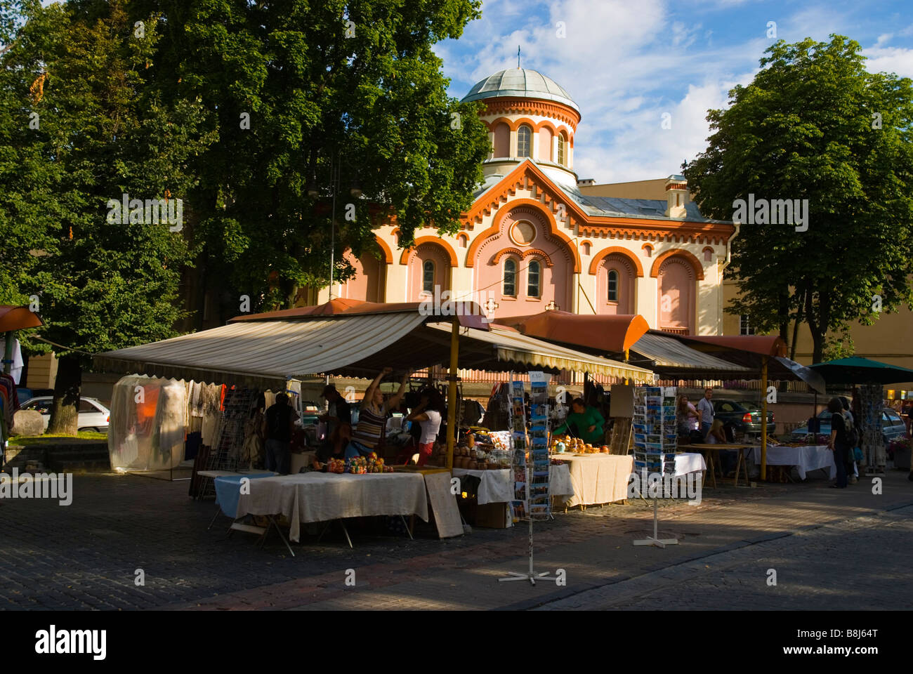 Market stalls along Pilies gatve street with St Parasceve's Orthodox church in background in Vilnius Lithuania Europe Stock Photo
