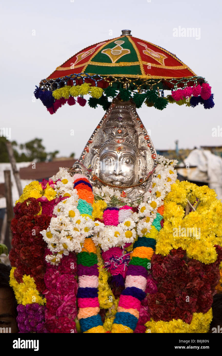 India Tamil Nadu Kumbakonam Hindu Thaipusam festival procession deity swathed in floral garlands Stock Photo