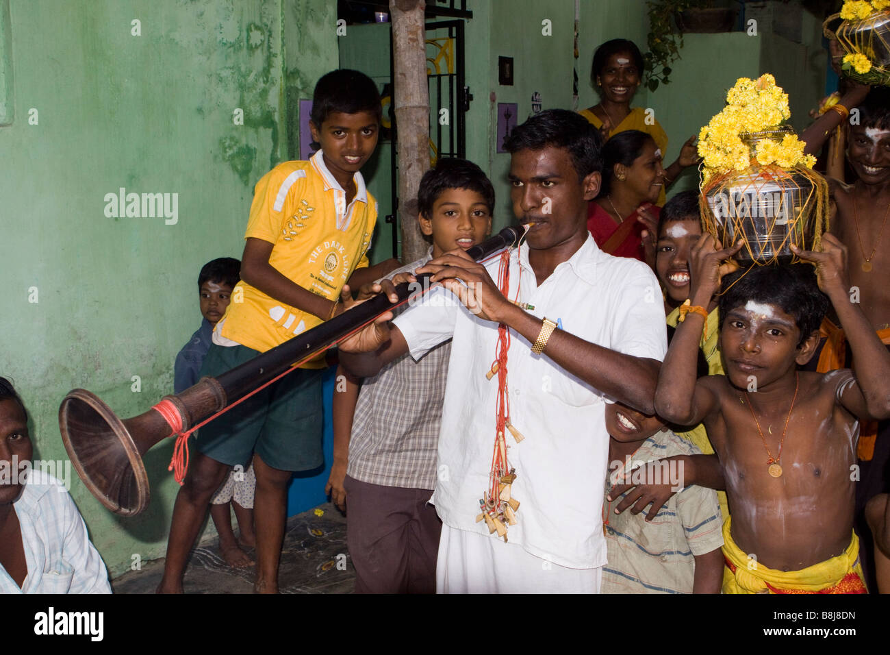 India Tamil Nadu Kumbakonam Hinduism Thaipusam festival procession musician playing nadaswaram trumpet Stock Photo
