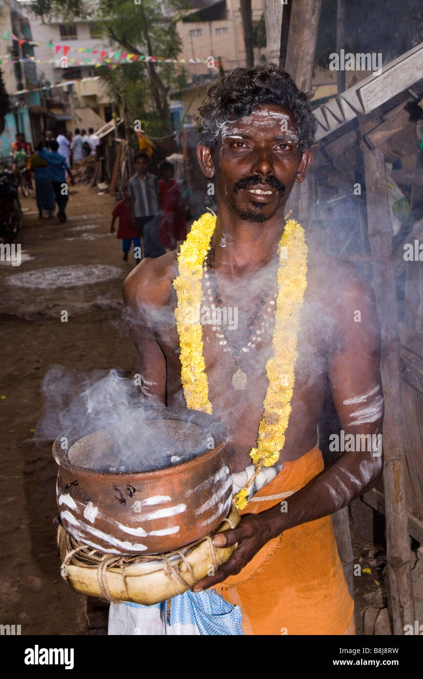 India Tamil Nadu Kumbakonam Hinduism Thaipusam festival devotee carrying smoking ceramic pot Stock Photo