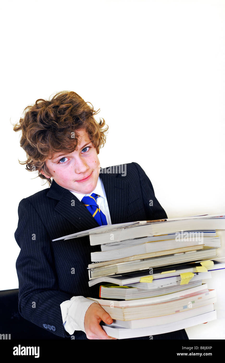 school boy carrying text books Stock Photo - Alamy
