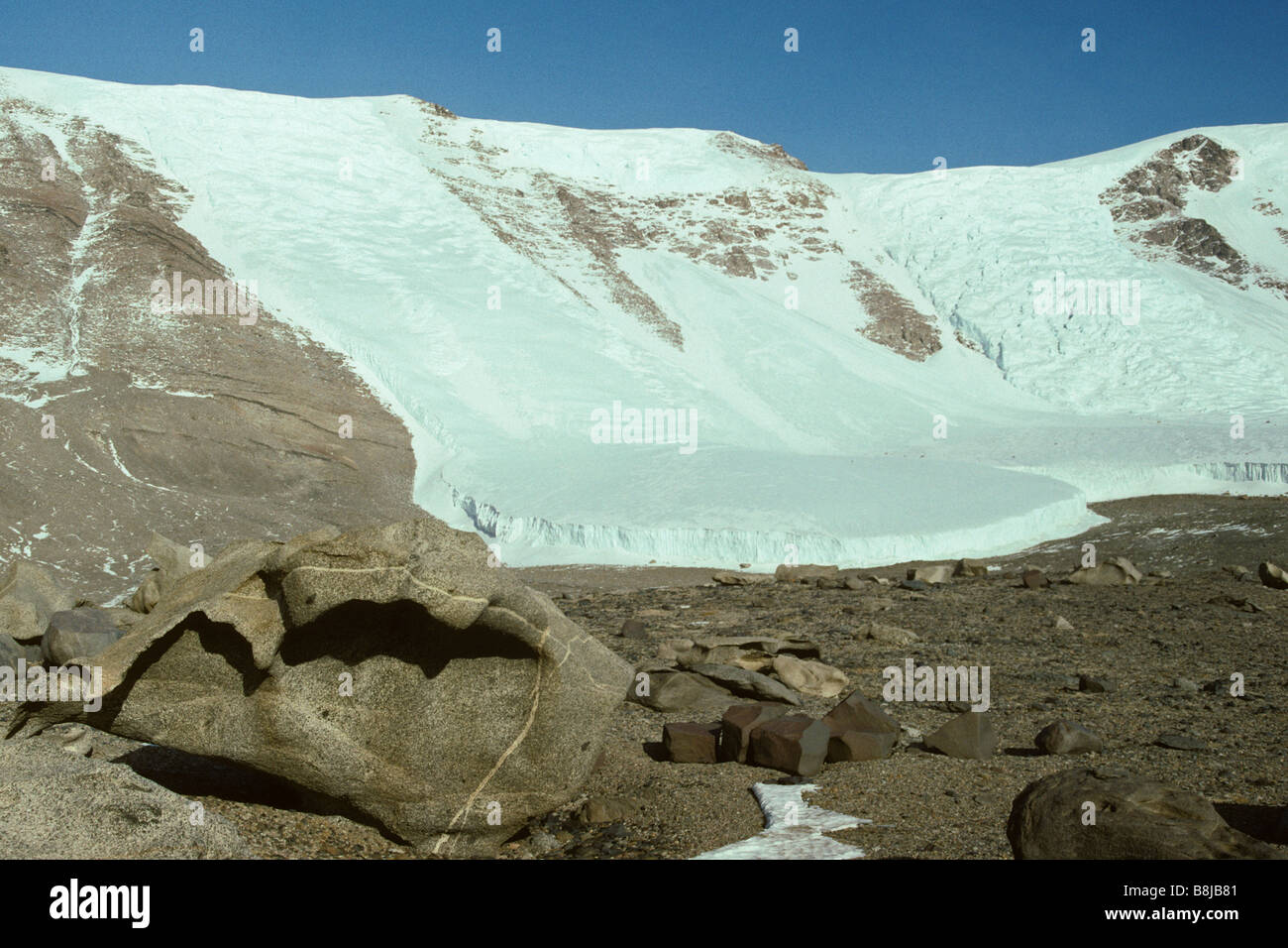 Ventifacts and glaciers in the scenic McMurdo Dry Valleys, Antarctica. Stock Photo