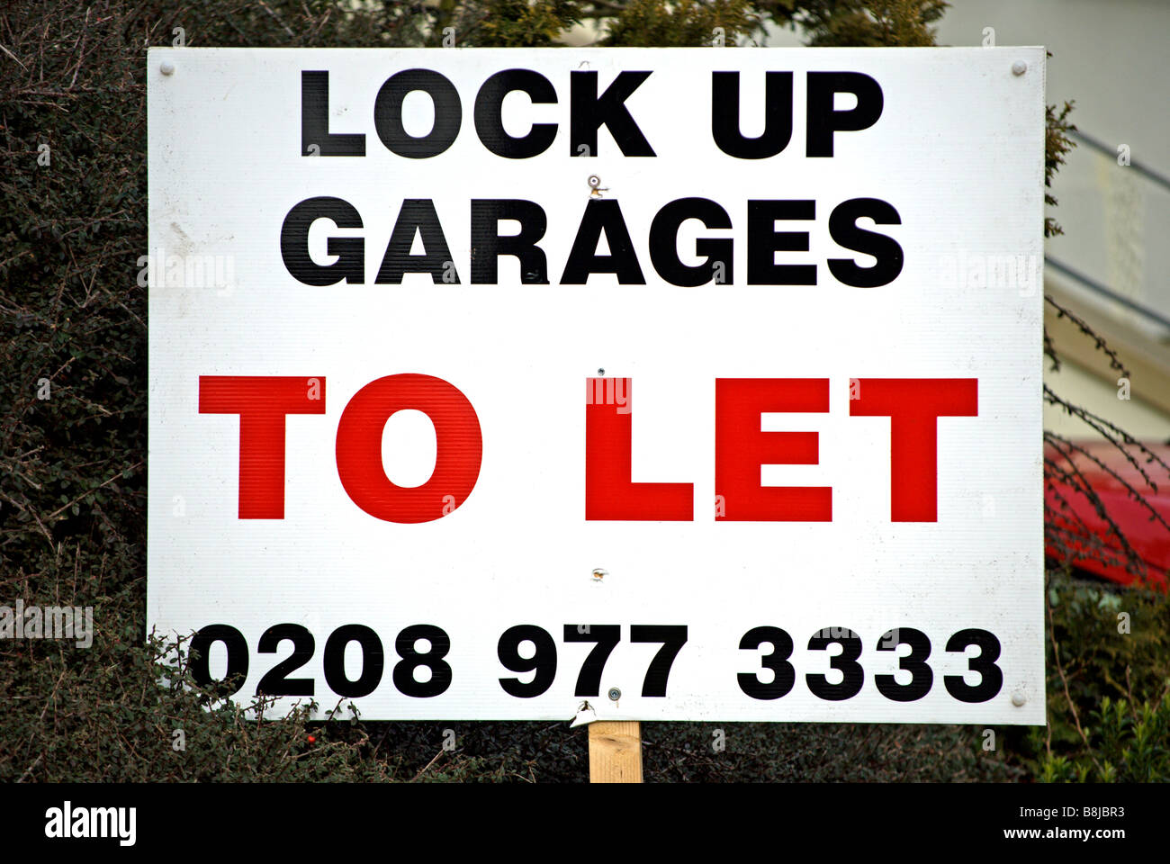lock up garages to let sign on a residential street in hampton wick
