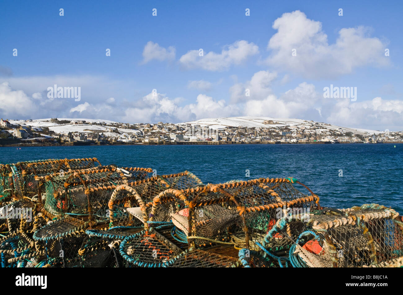 dh  STROMNESS ORKNEY Crab and lobster creels Hamnavoe harbour snow hills Stock Photo