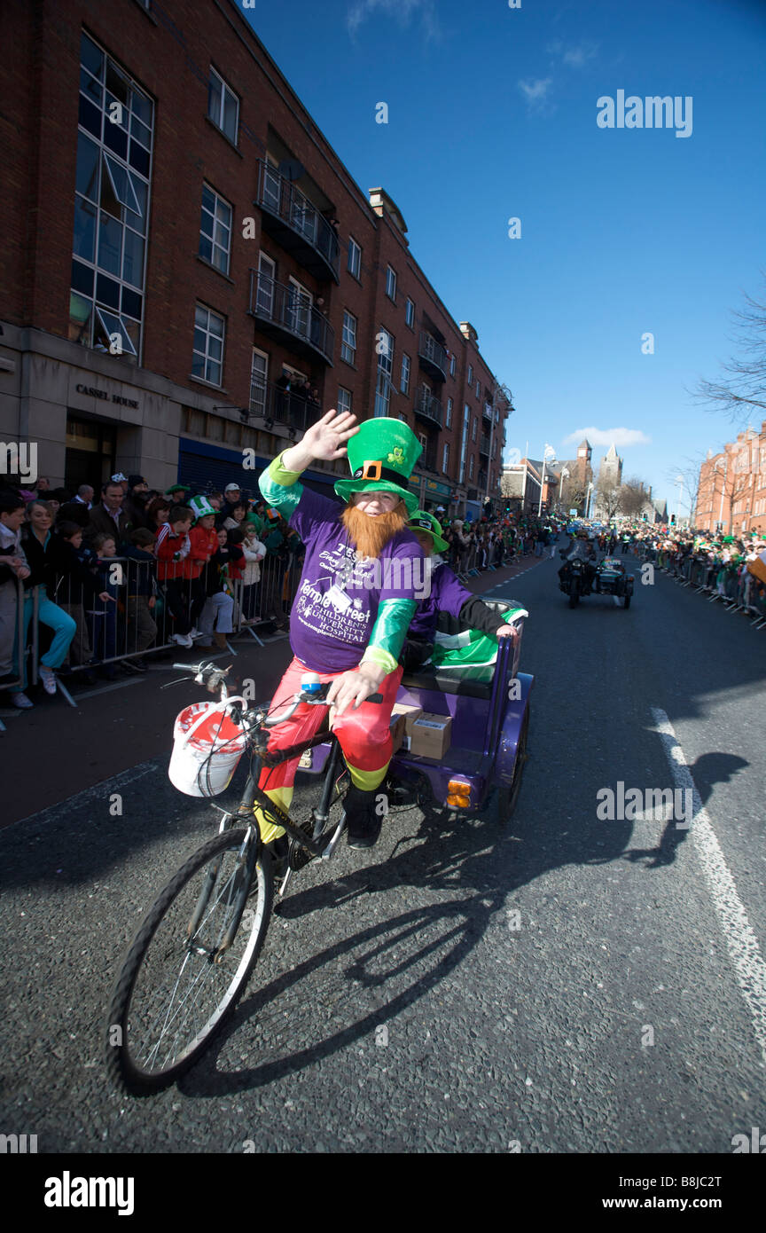 A participant waves to the crowd in the St Patricks Day Parade in Dublin Ireland Stock Photo
