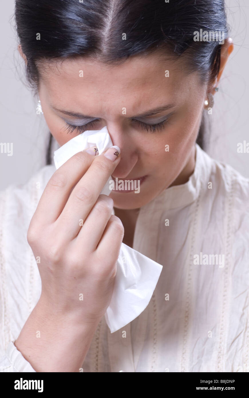 Woman crying and wiping tears with tissue Stock Photo Alamy