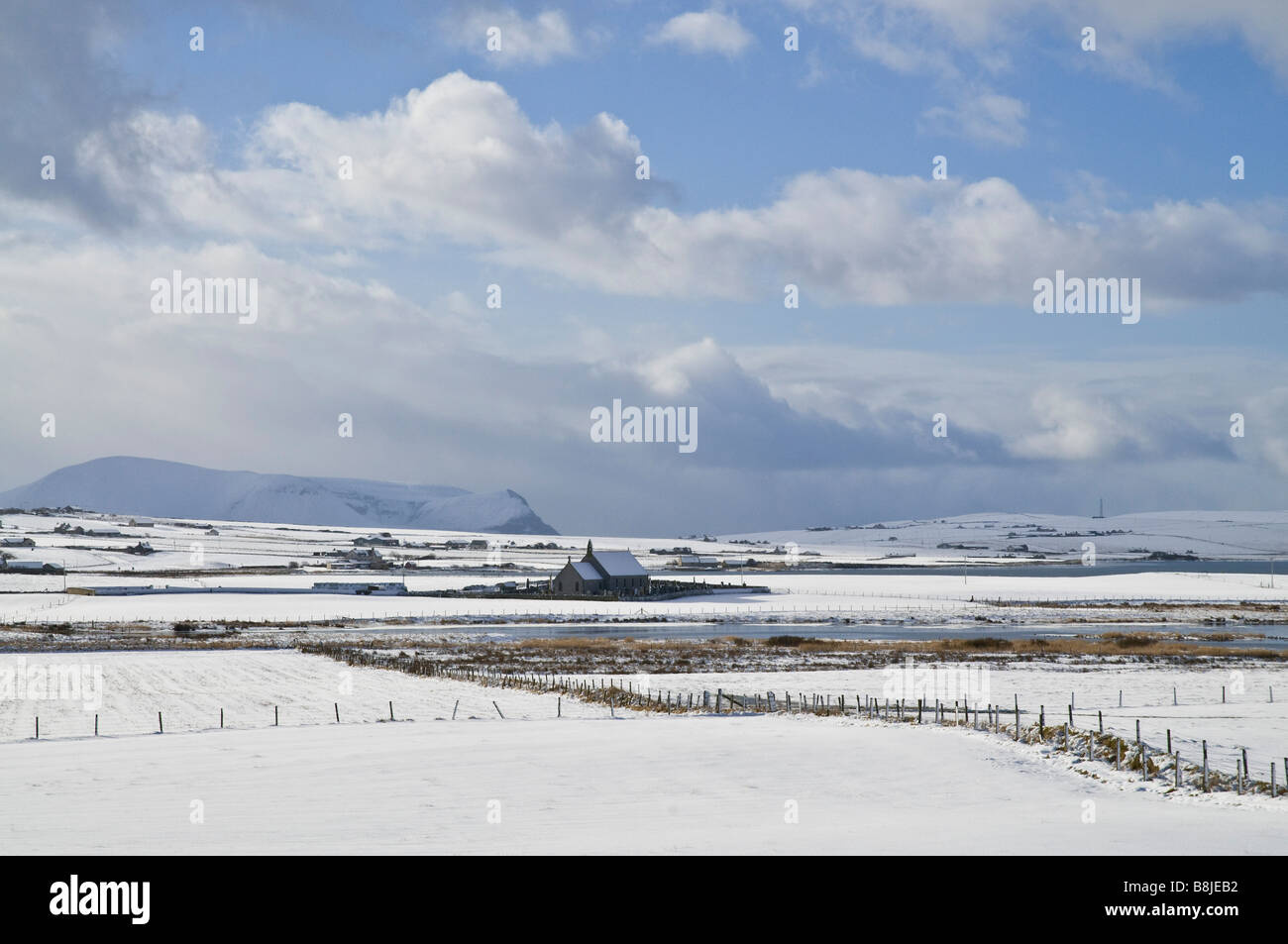 dh  STENNESS ORKNEY Snowscape landscape Loch Stenness church snow winter mainland landscapes Stock Photo