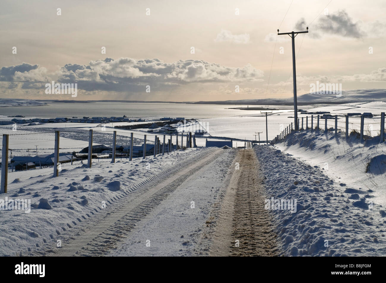 dh Quholm STROMNESS AREA ORKNEY Icy snow roads views Scapa Flow empty road countrylane winter slush Stock Photo