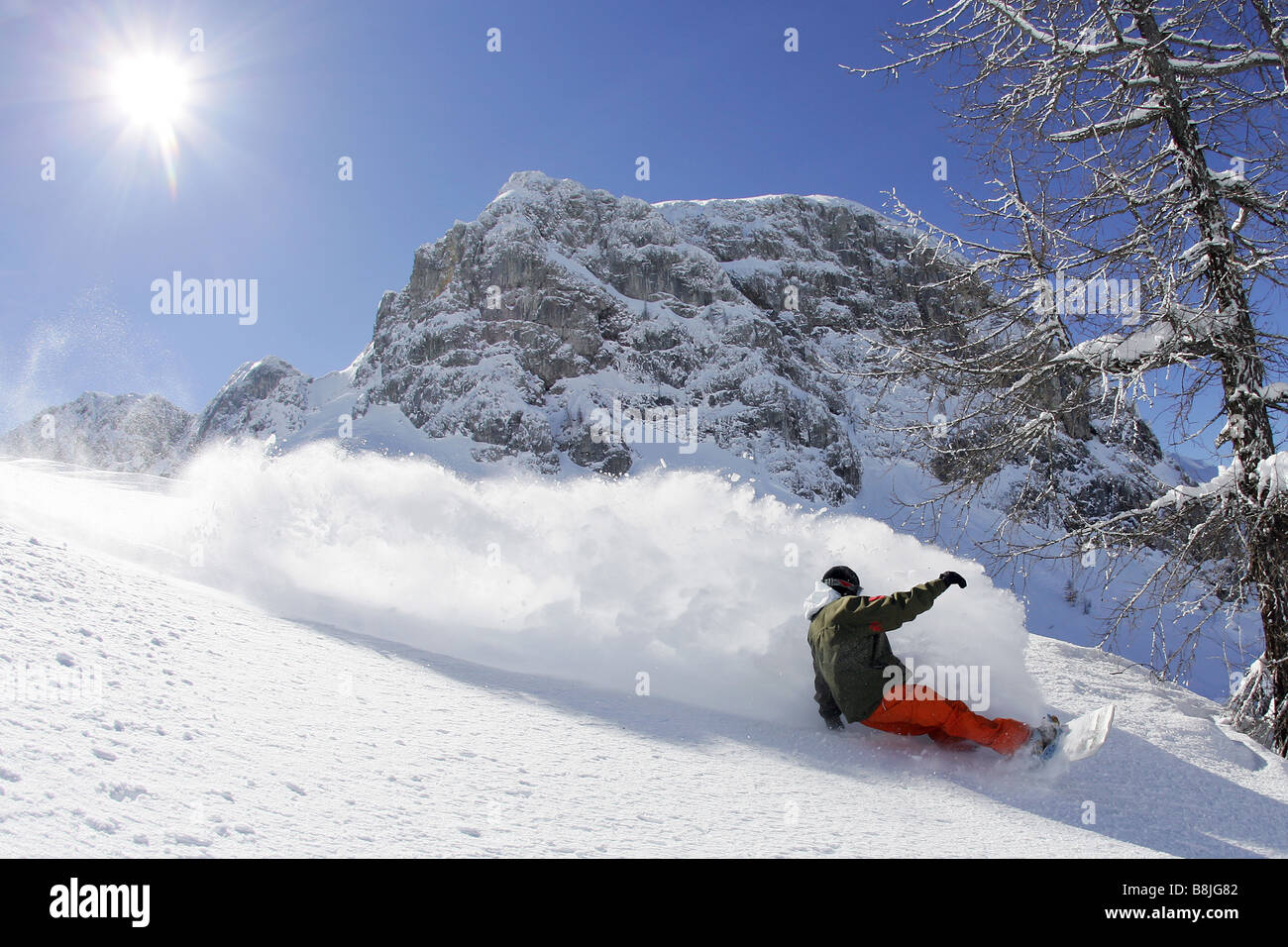 Snowboarder Maciek Swiatkowski going downhill in Nassfeld, Austria Stock Photo