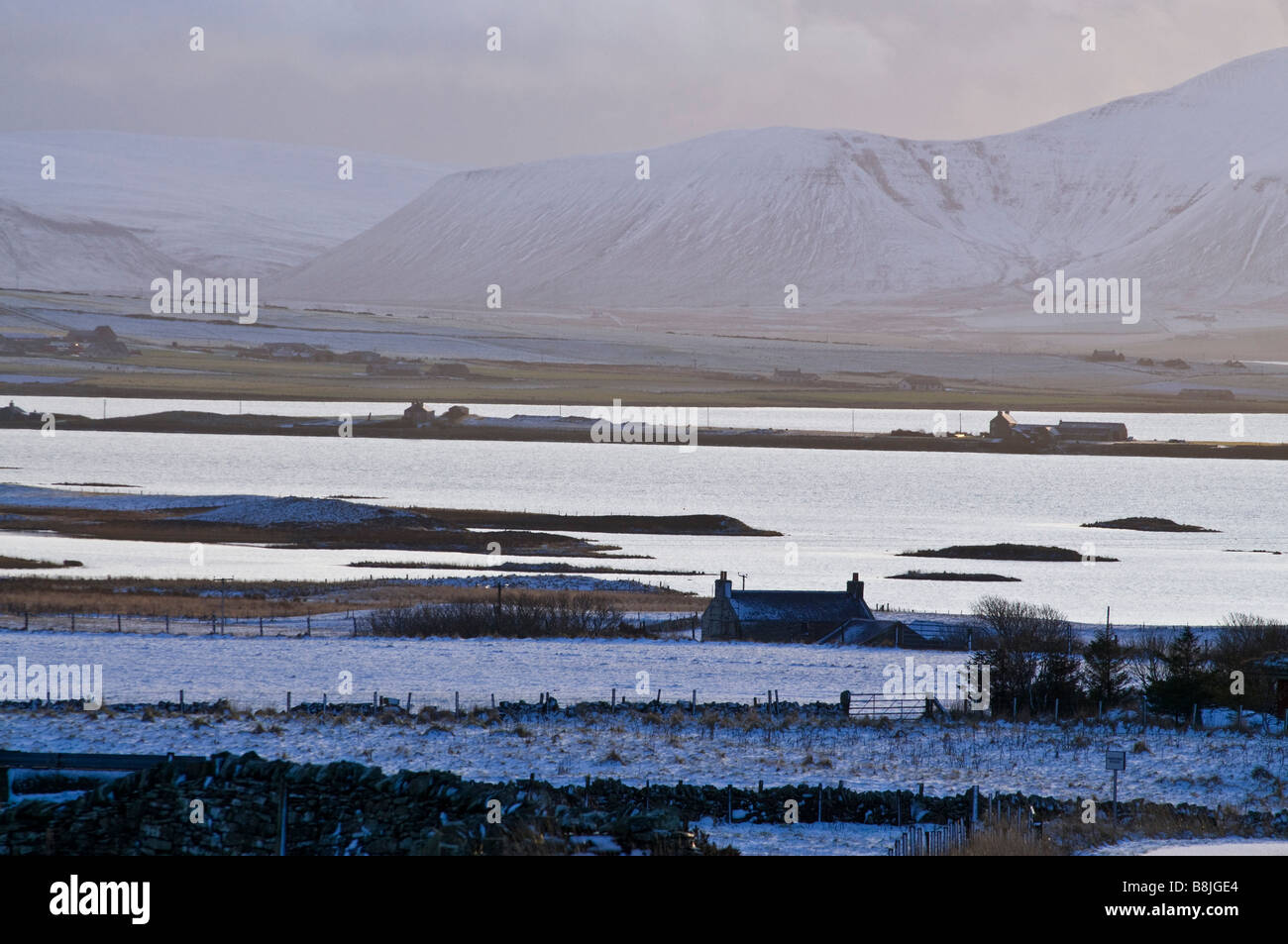 dh  HARRAY ORKNEY Loch Harray Loch Stenness and Hoy Hills snowy countryside Stock Photo