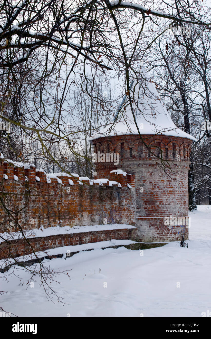 Old monastery brickwall winter scene on sunset. Stock Photo