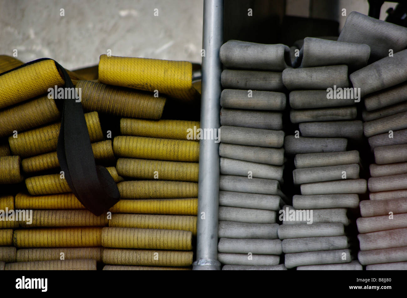 In case of emergency, arson, flames or rescue. Fire hose is stacked in a ladder truck waiting to be pulled for the fire. Stock Photo