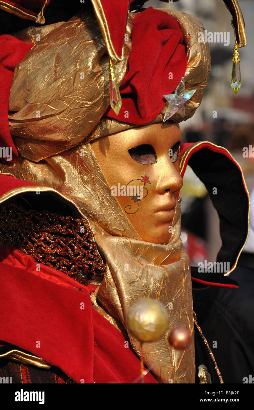 Red and Gold Venice Carnival mask and costume Stock Photo - Alamy