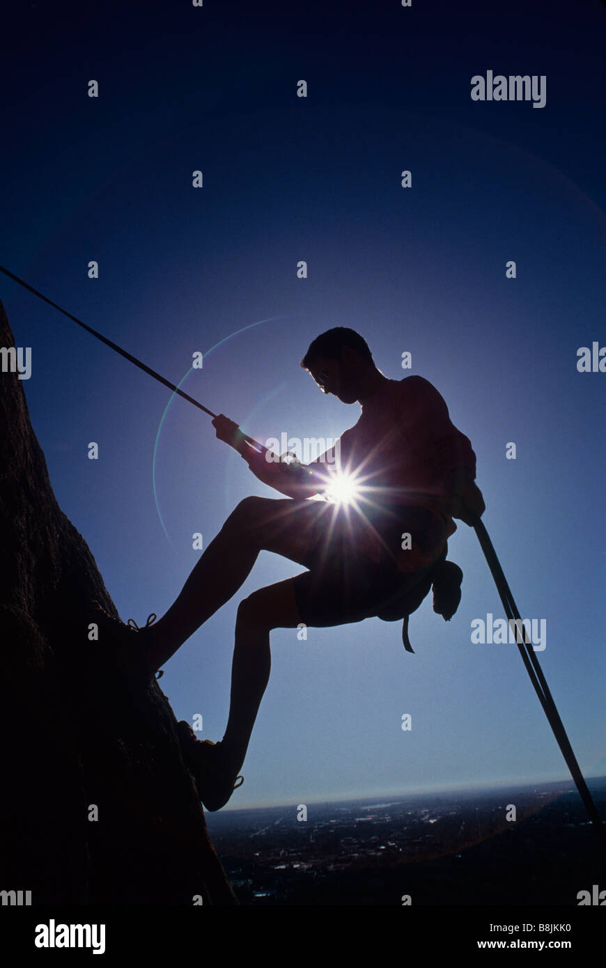 Silhouette of rock climber Stock Photo