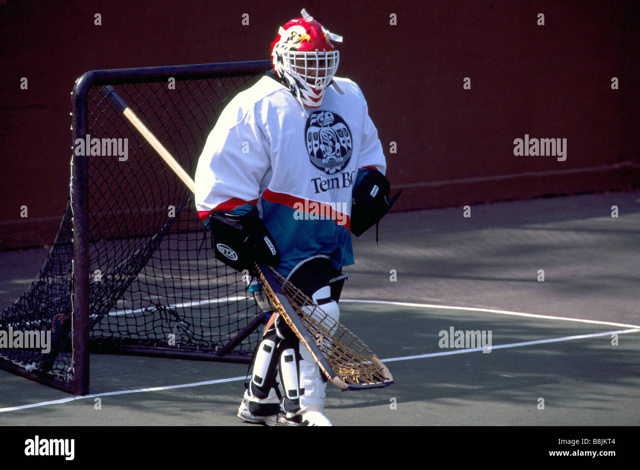 Native American Indian Goalie defending Net in a Game of Lacrosse Stock