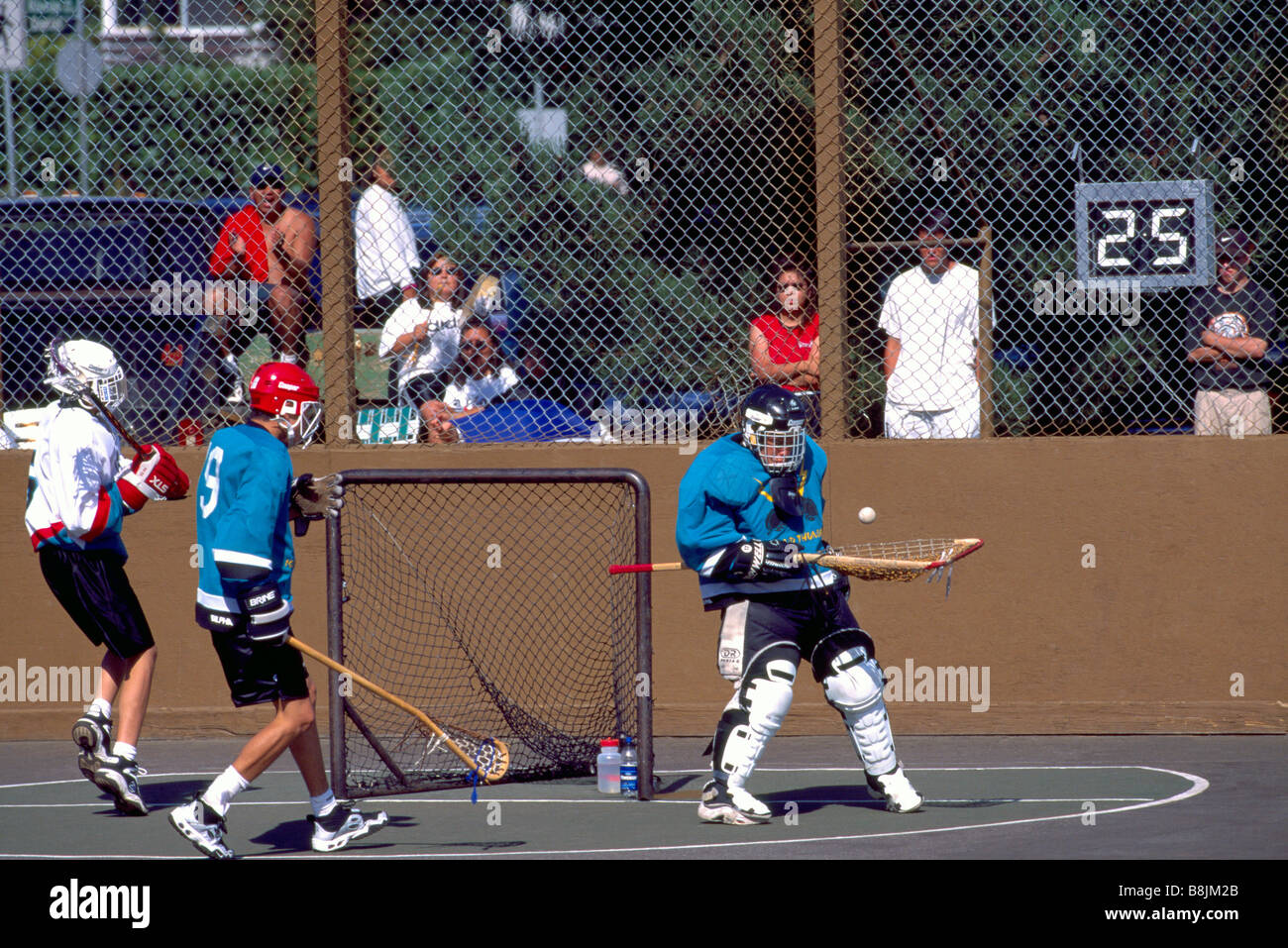 Native American Indians playing a Game of Lacrosse and Goalie saving a ...