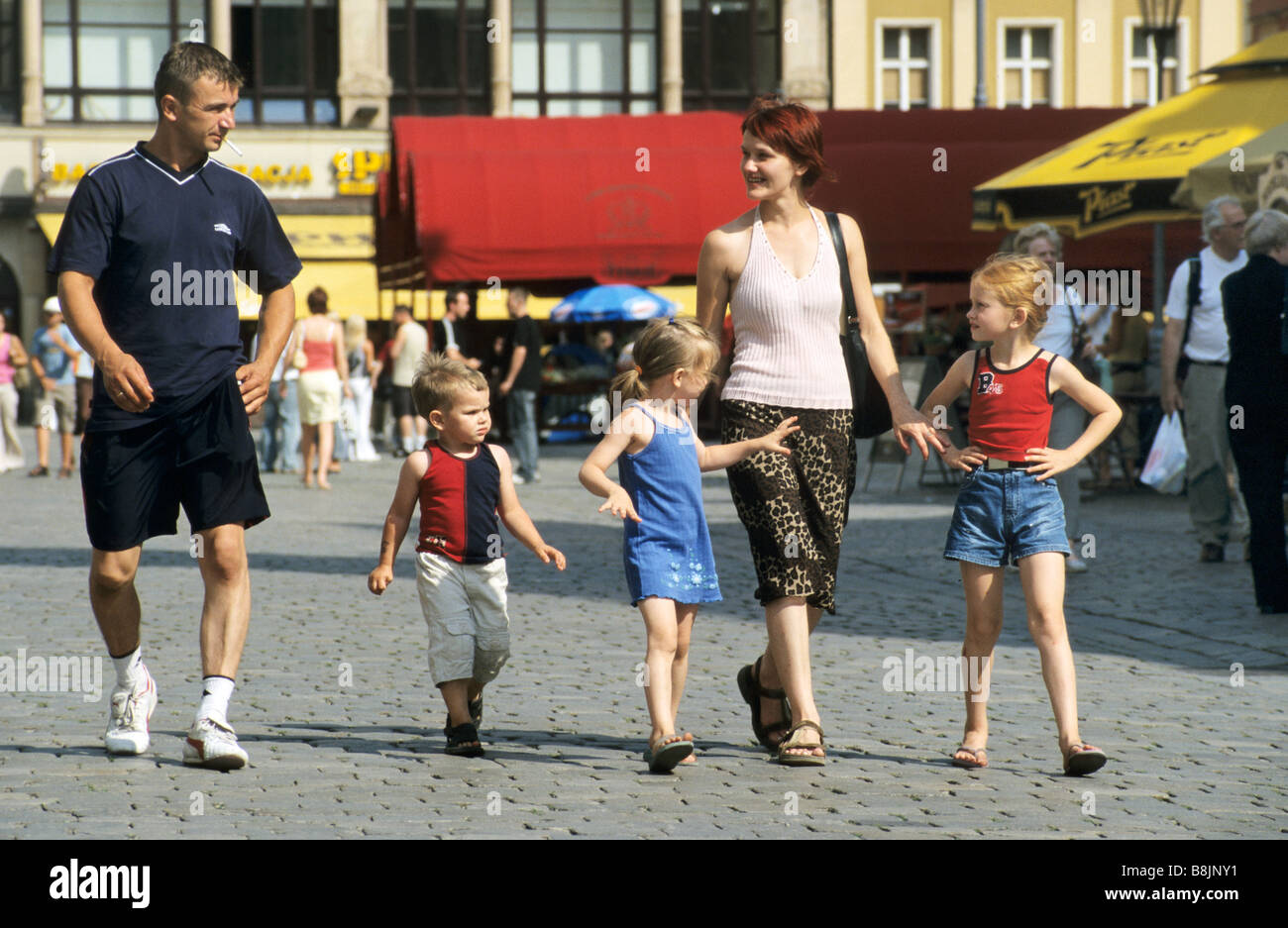 Family strolling at Rynek (Market Square) in Wrocław Poland Stock Photo