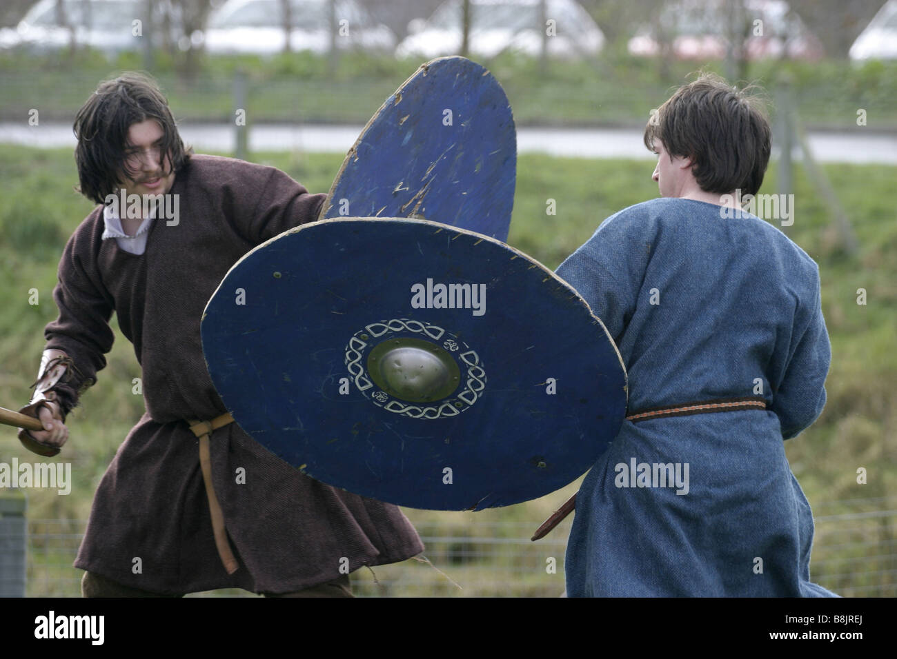 iron age reinactor role players in costume battle shields axes Stock Photo