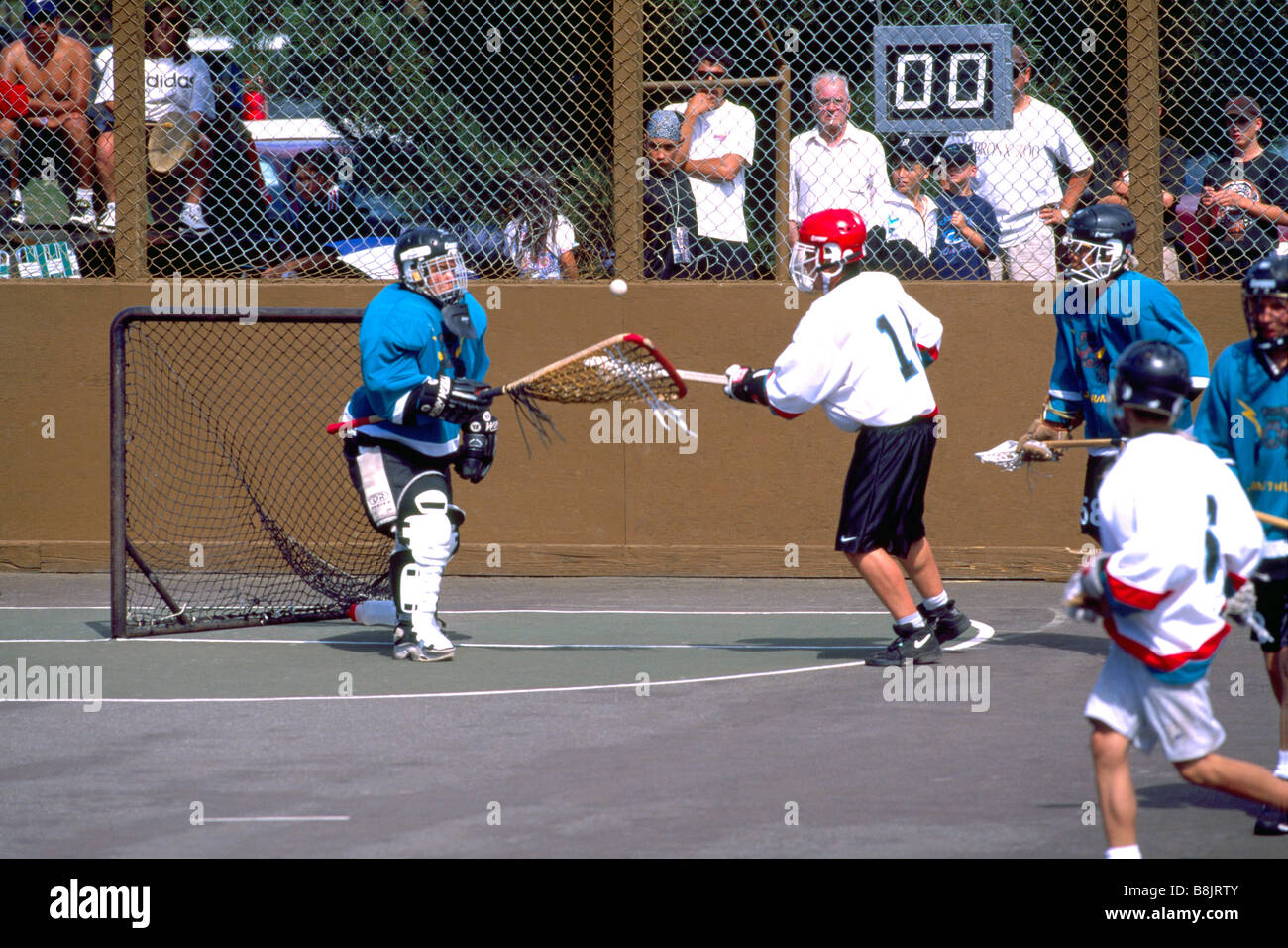 Native American Indians playing a Game of Lacrosse and Goalie saving a ...