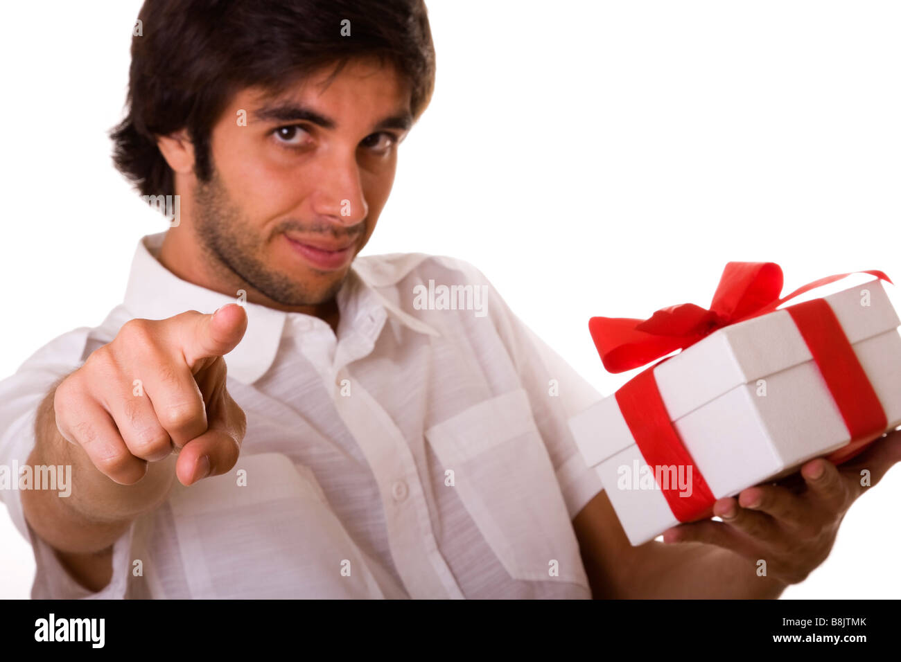 young man with a wrapped gift box for you Stock Photo Alamy