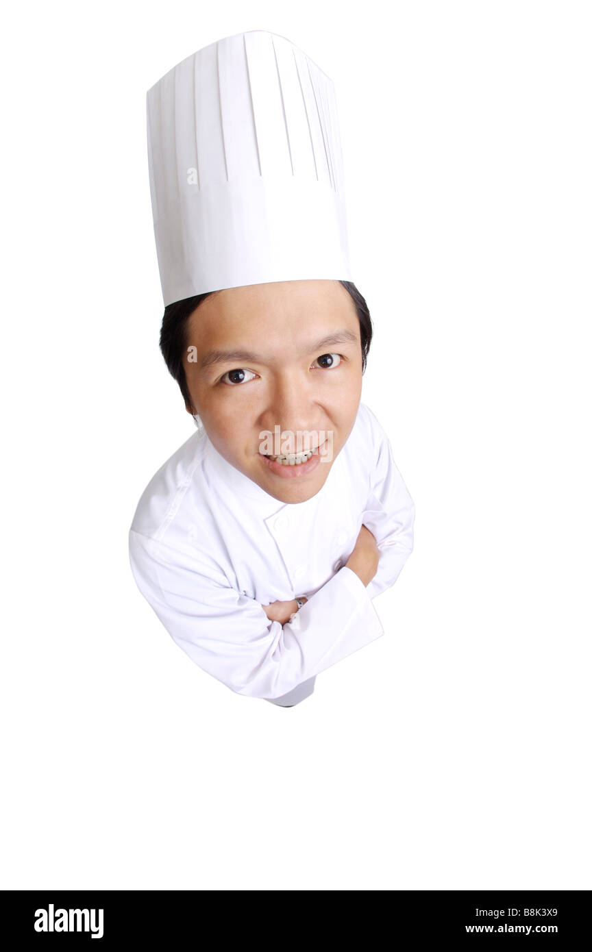 Chef standing with hands on chest and looking at the camera Stock Photo