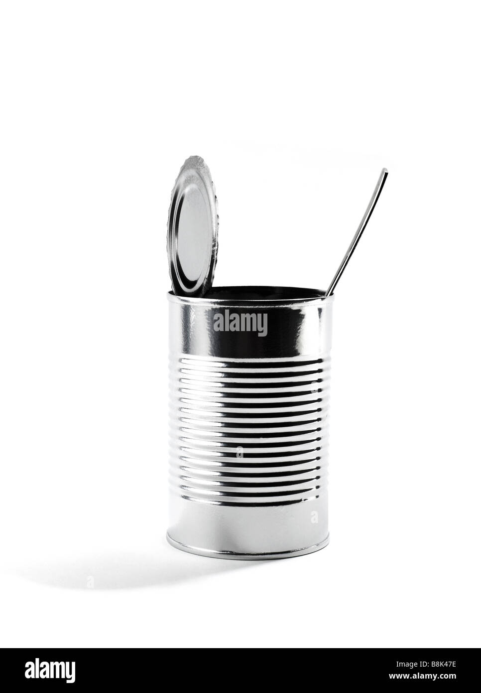 Open tin can with silverware Stock Photo