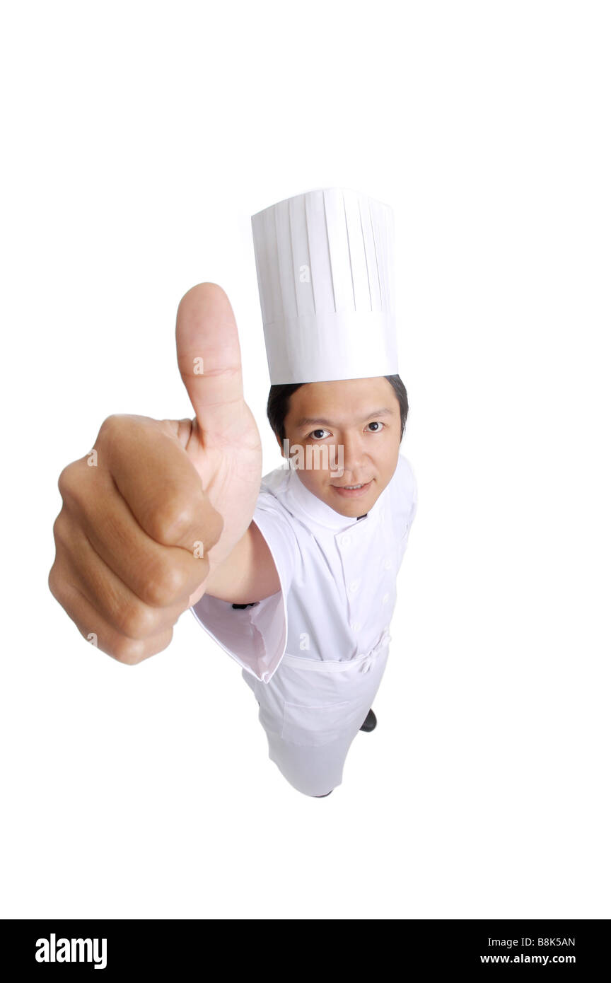 Chef looking at the camera with thumbs up Stock Photo