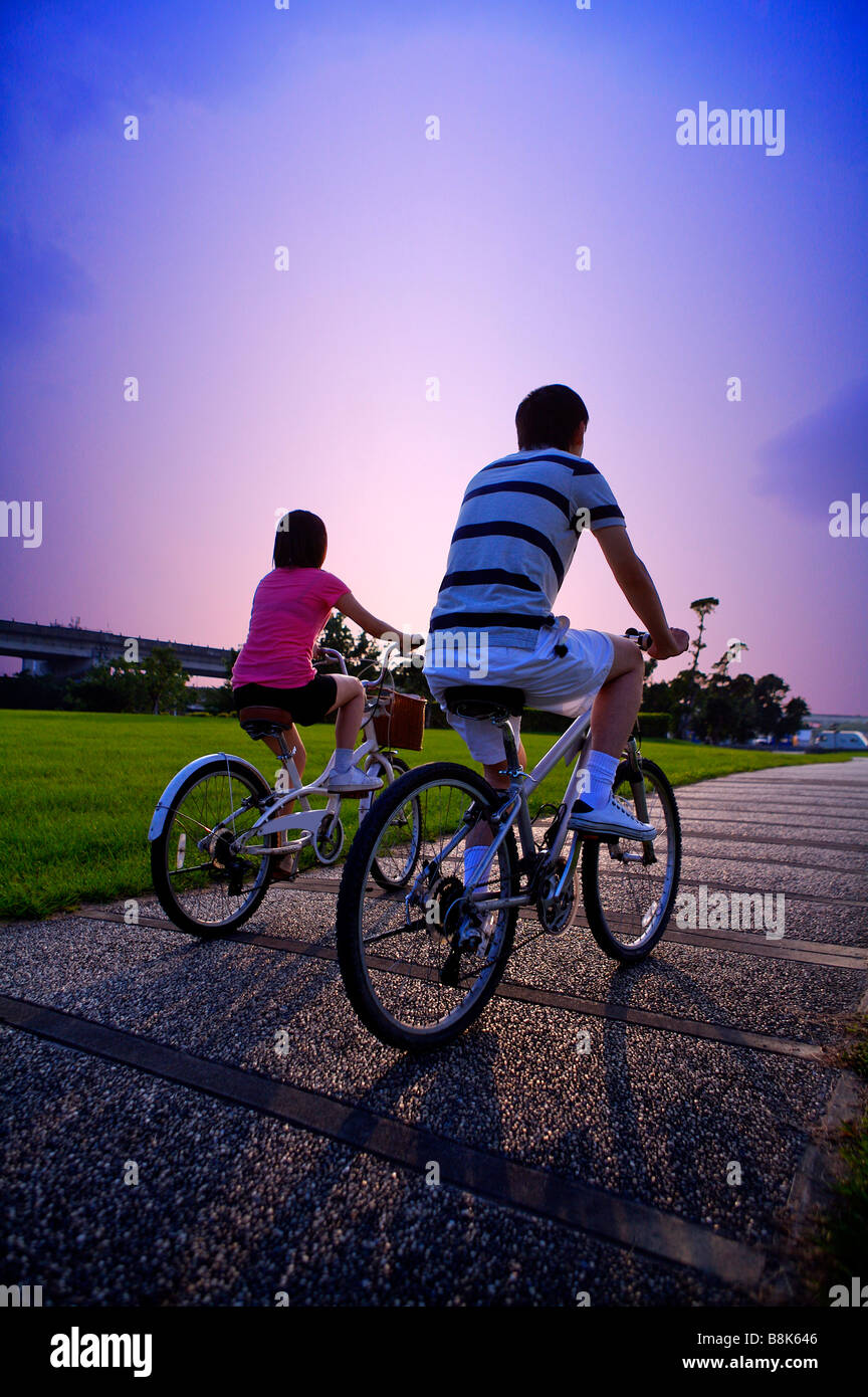 Rear view women cycling on hi-res stock photography and images - Alamy