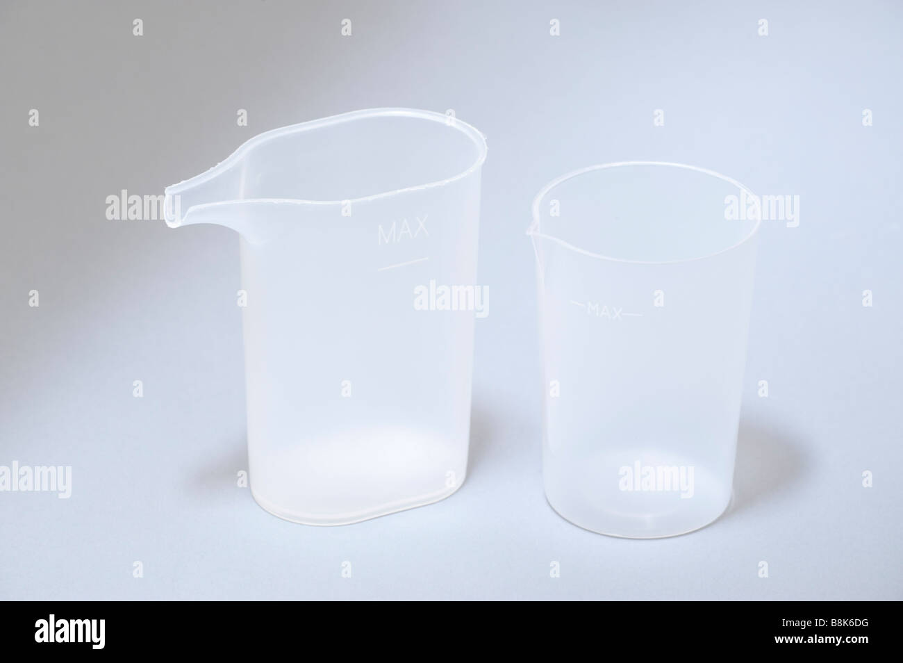 Two plastic water measuring containers Stock Photo Alamy