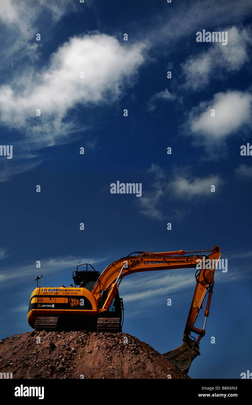 A mechanical digger on top of earth Stock Photo