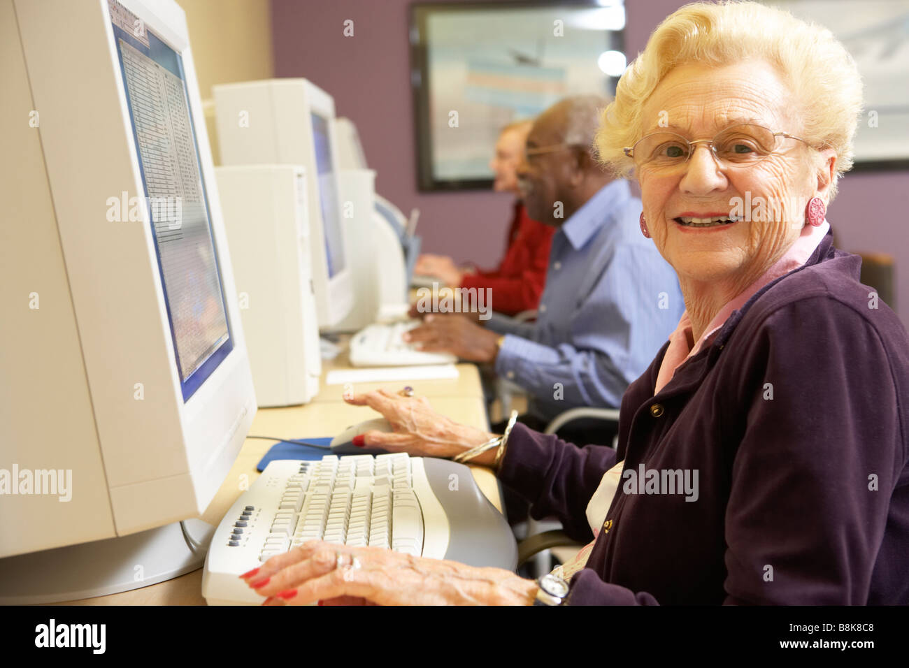 Senior woman using computer Stock Photo